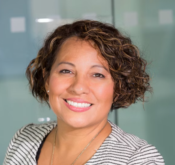 Woman with curly hair smiling